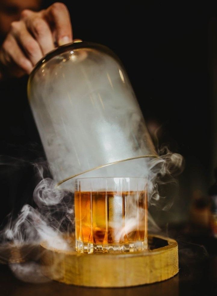 Whisky cocktail with smoke presentation