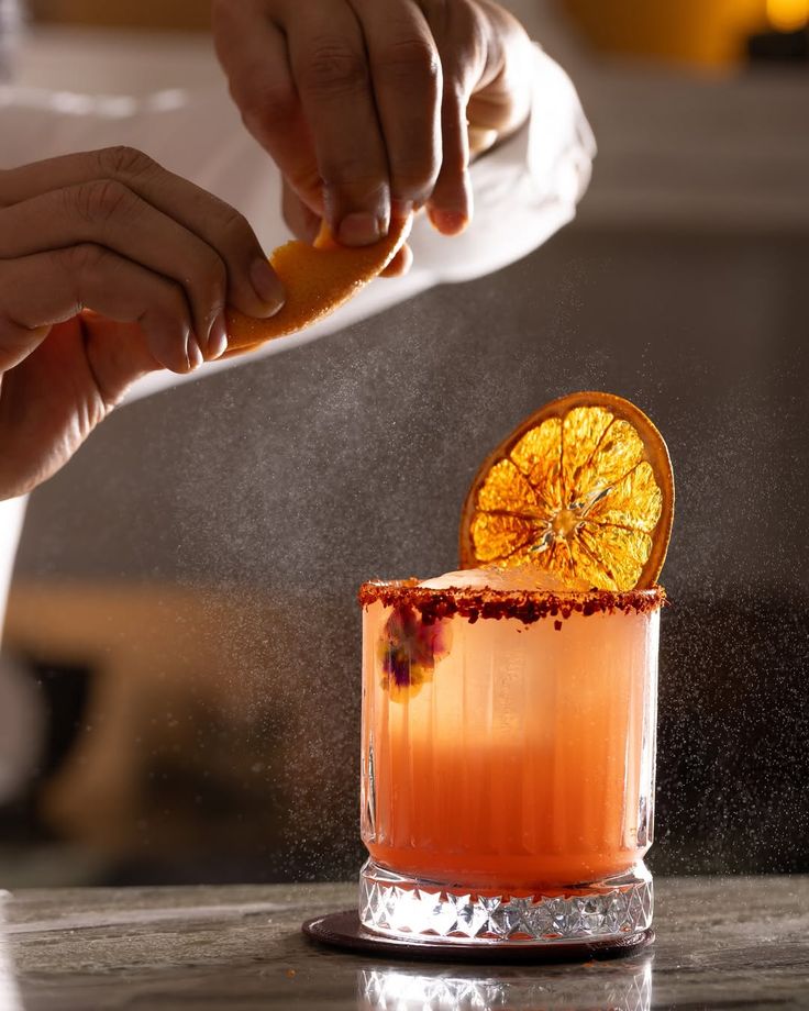 Bartender preparing a mezcal cocktail