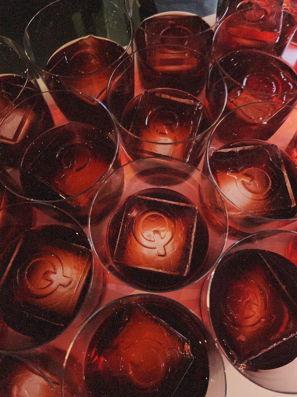 Bartender preparing a cocktail with large ice cubes
